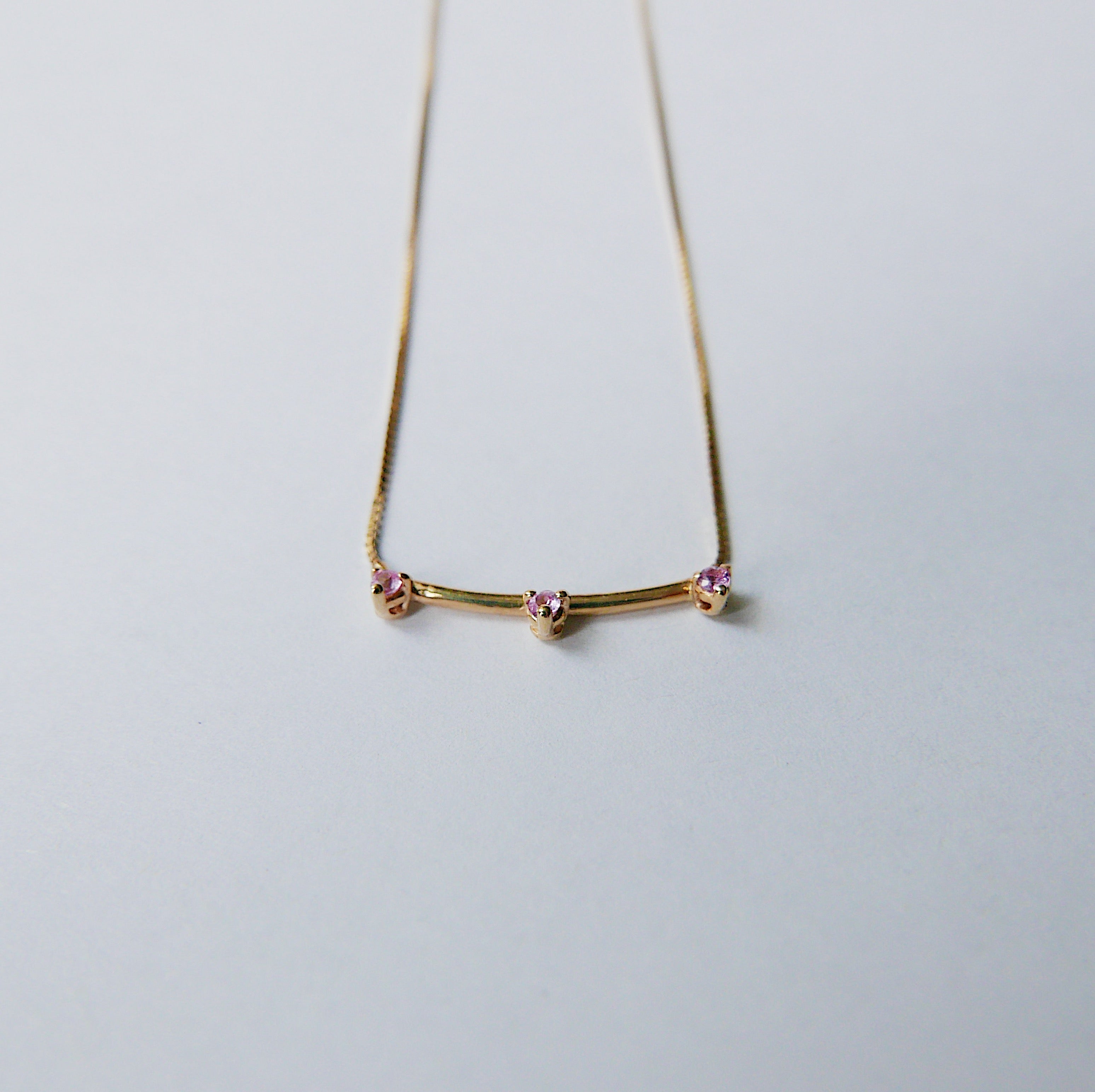 Simple staple everyday necklace with a pop of color.  Normally $580  Details: Pink Sapphires measures about 1.7mm Total necklace length is 16.75 inches  14k Yellow Gold  Free Shipping on Domestic Orders over $50  Materials: 14 yellow gold