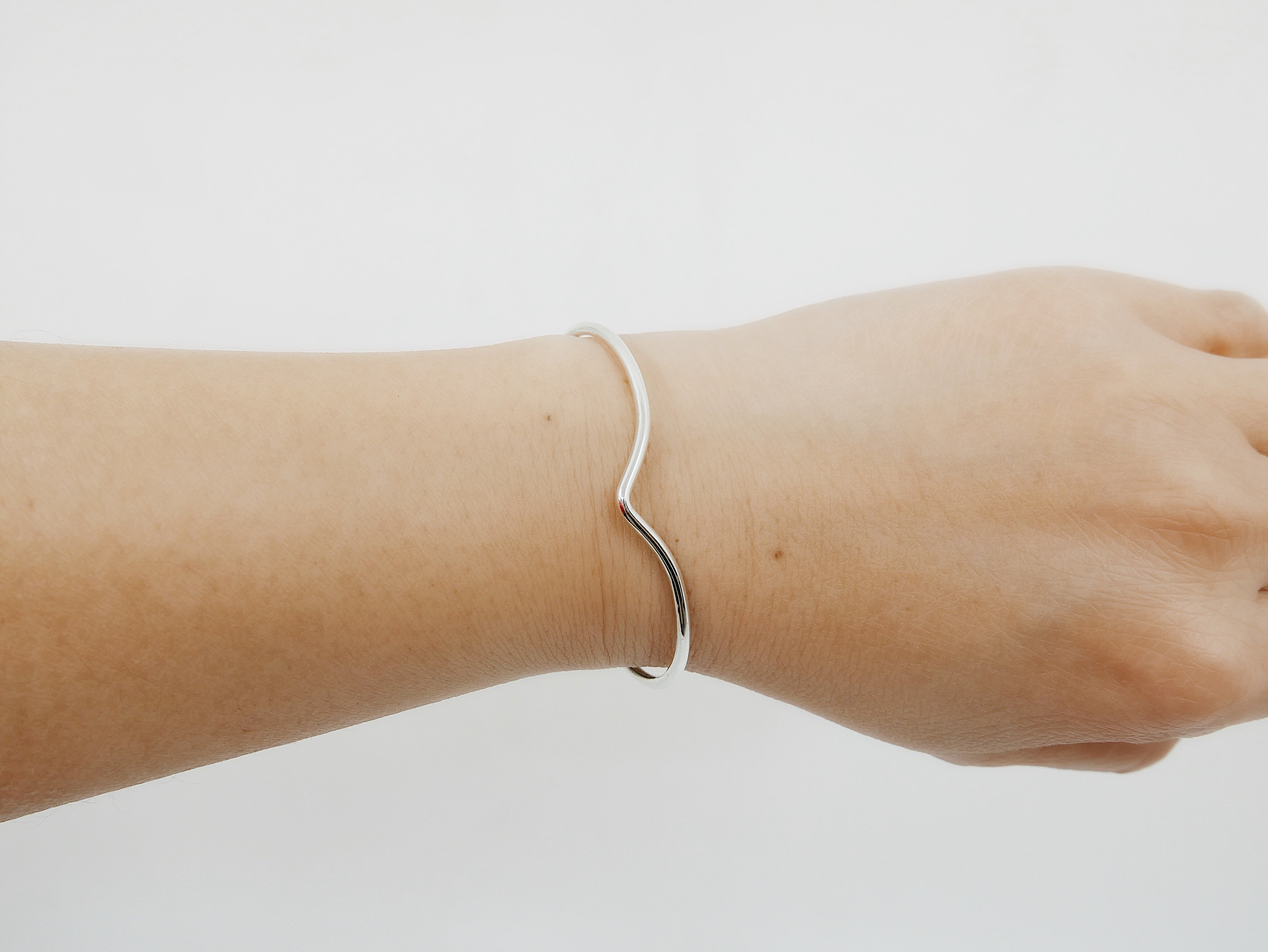 On hand of Chevron Bracelet, Sterling SIlver