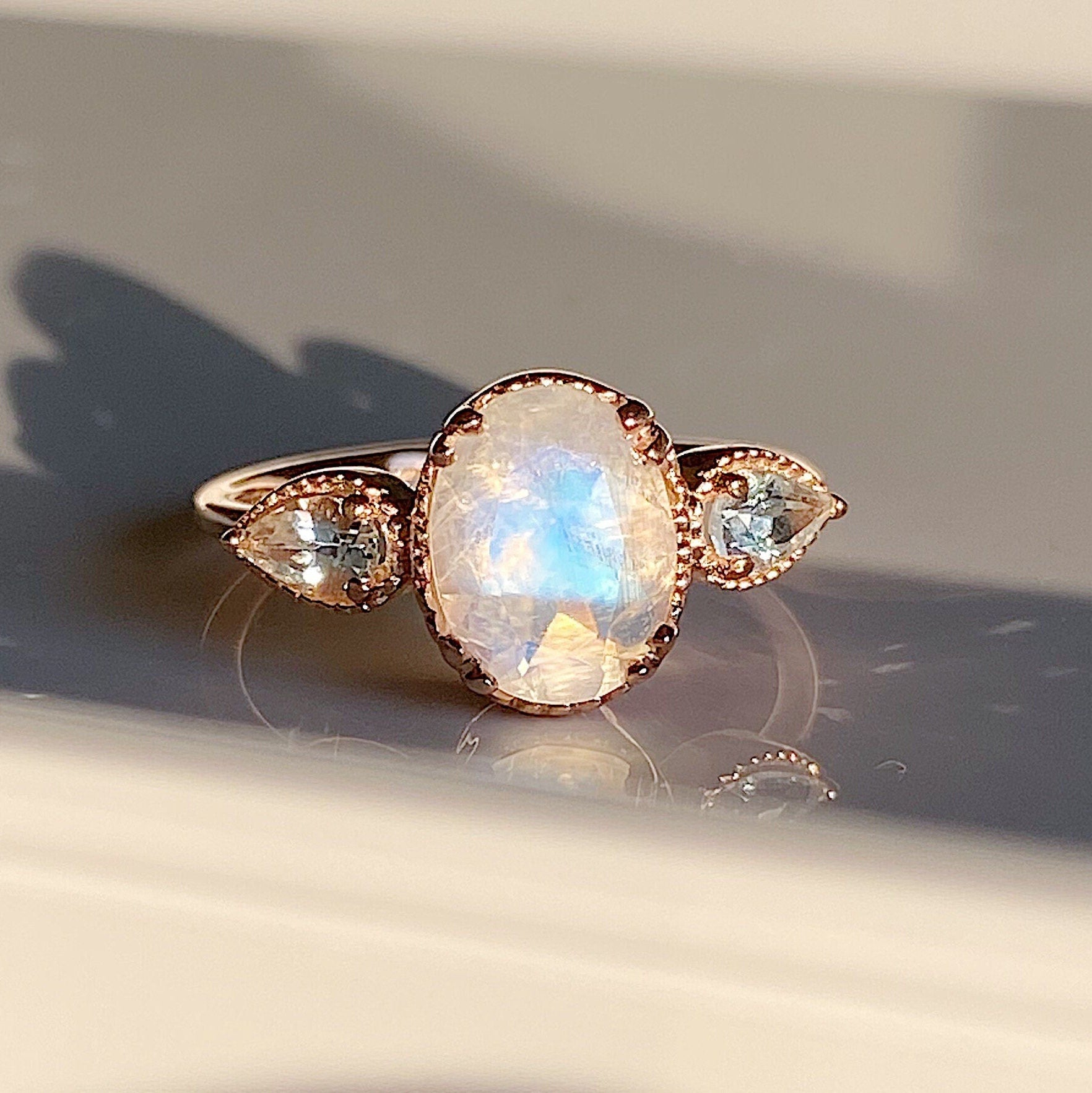 New Dawn Moonstone and Aquamarine ring, Oval Moonstone Ring with Pear aquamarine Side Stones, three stone moonstone ring