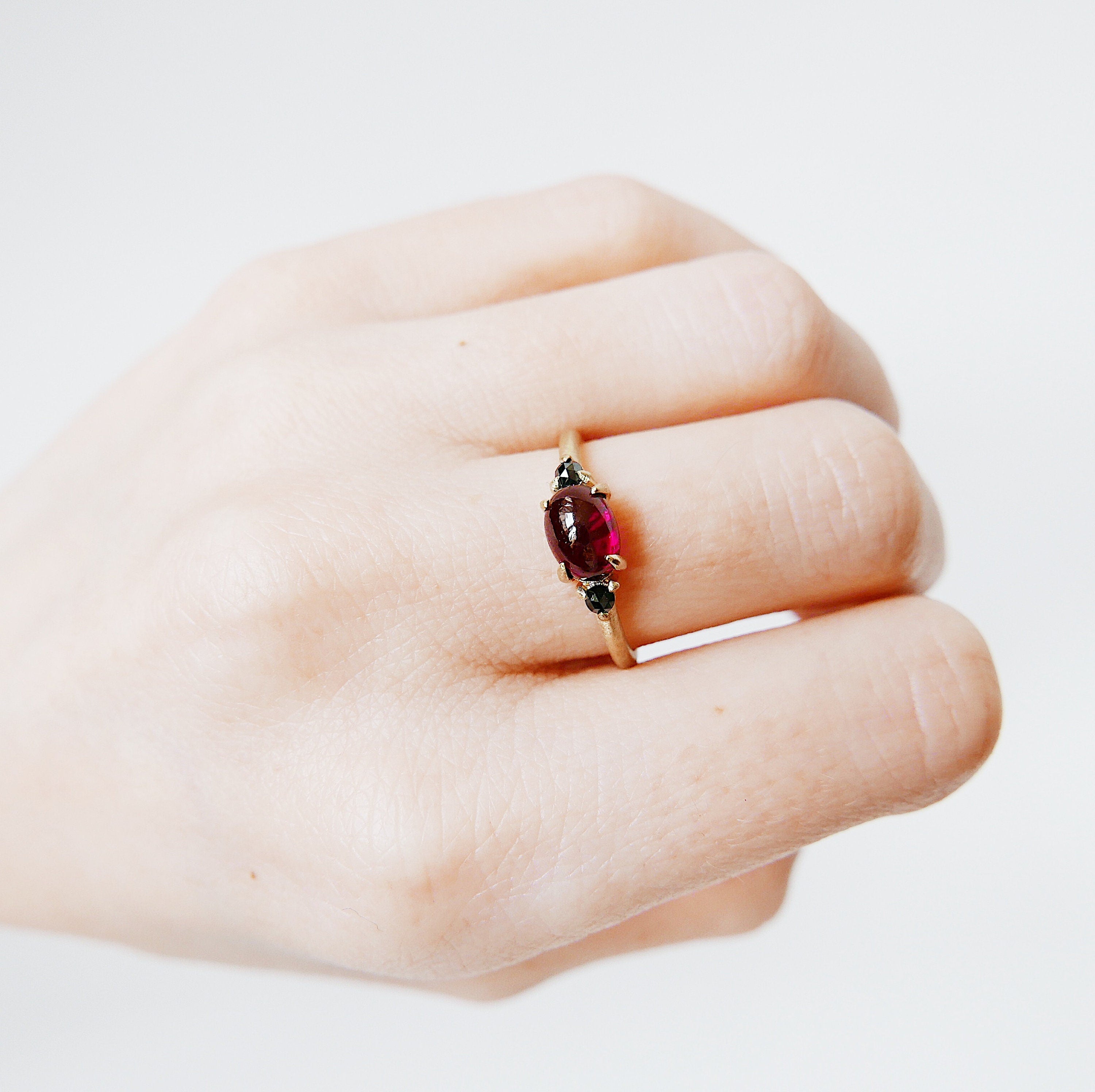 Oval garnet ring, three stone ring, garnet and black diamond ring, 14k gold cabochon rhodolite garnet ring