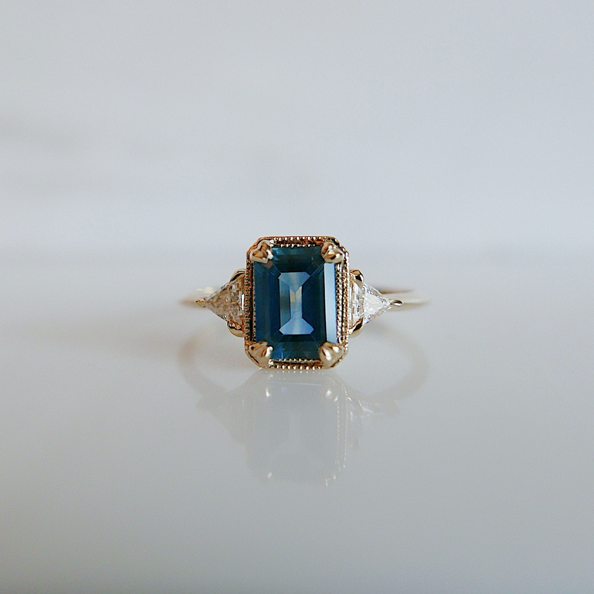 Amelia blue sapphire Ring, 3 stone ring, classic alternative engagement ring, light blue sapphire emerald cut and Diamond trillion ring